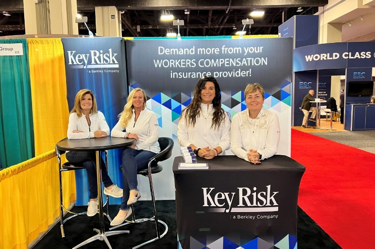 Four team members pose for a picture at day 3 of an American Staffing Association convention