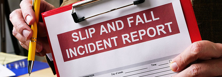 An inspector holds a clipboard with writing that says "Slip and Fall Incident Report"