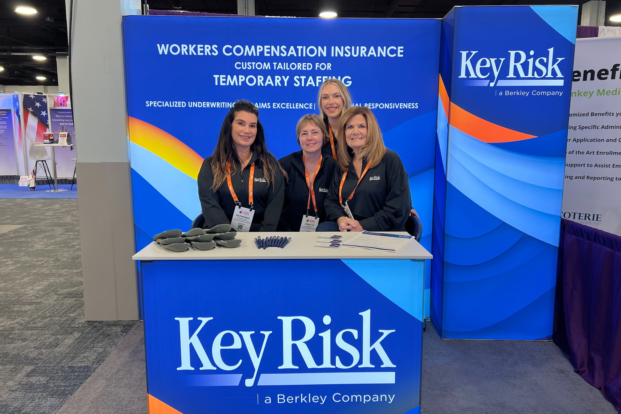 Four team members pose at the Staffing World conference. 